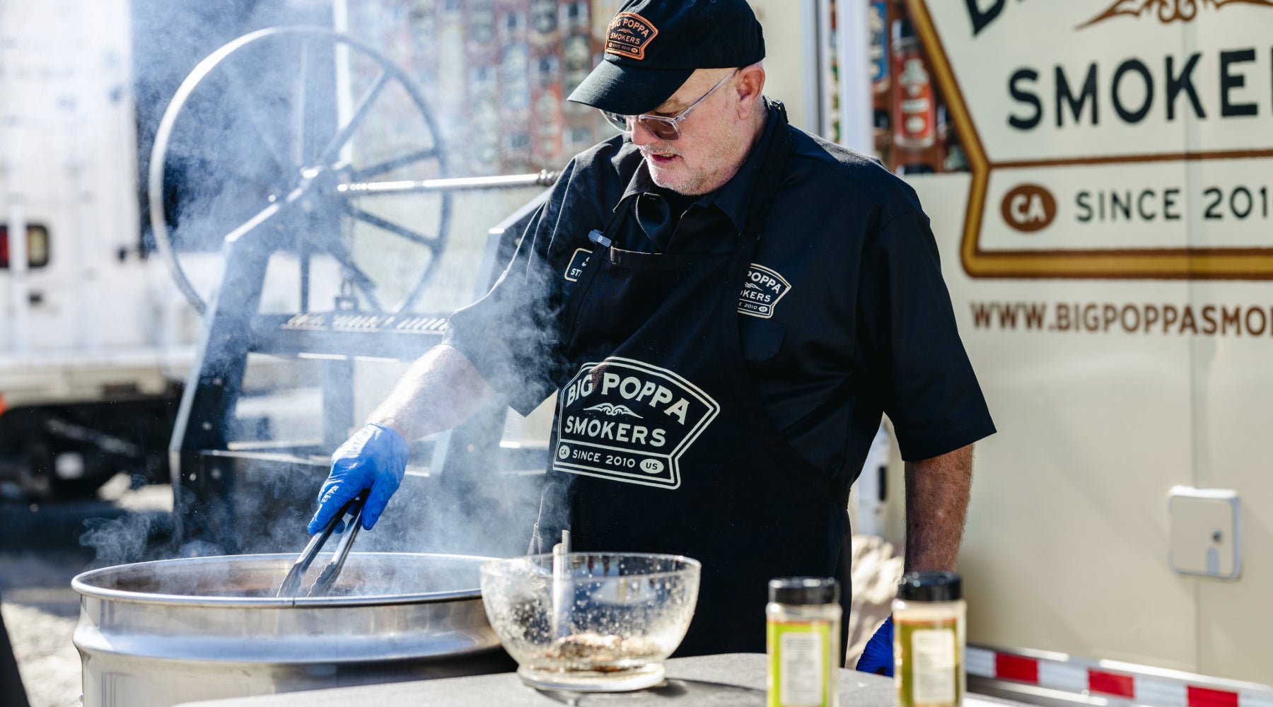 Sterling cooking chicken wings on the drum smoker