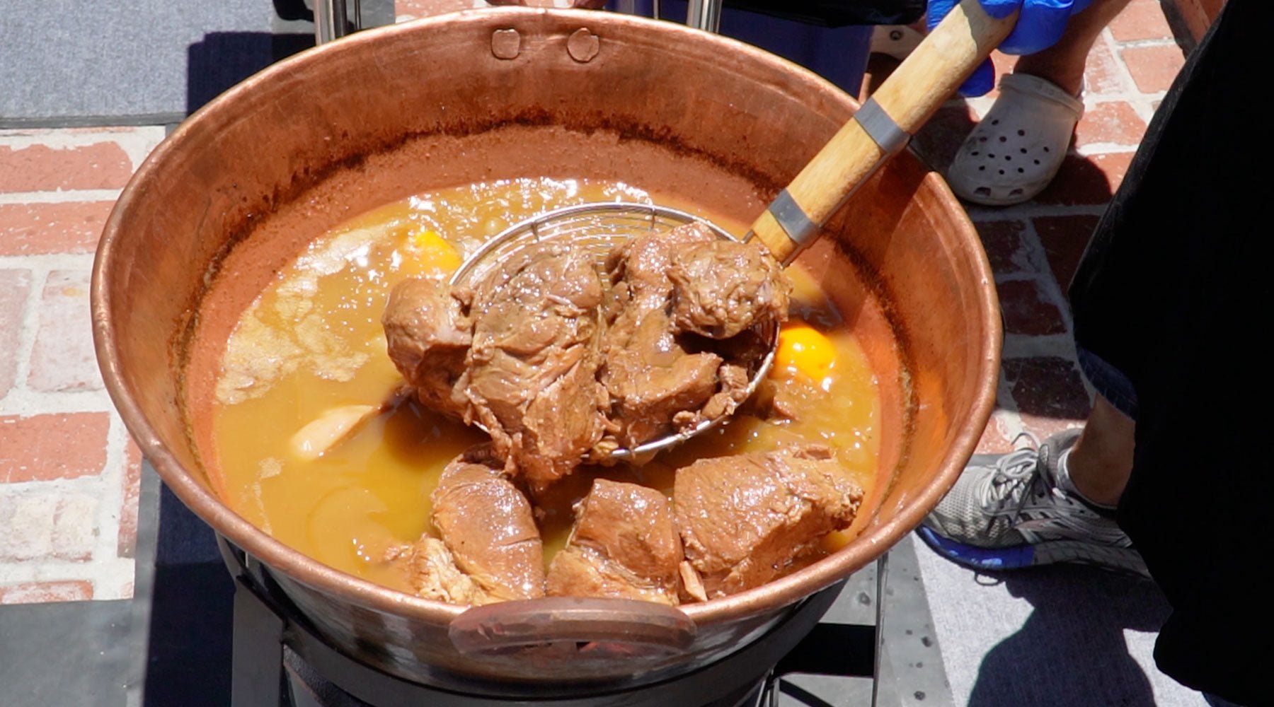 Making traditional copper pot carnitas
