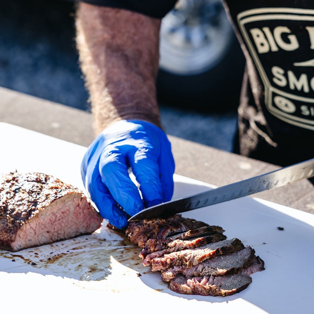 Big Poppa using his Lamson knife to cut into the meat.