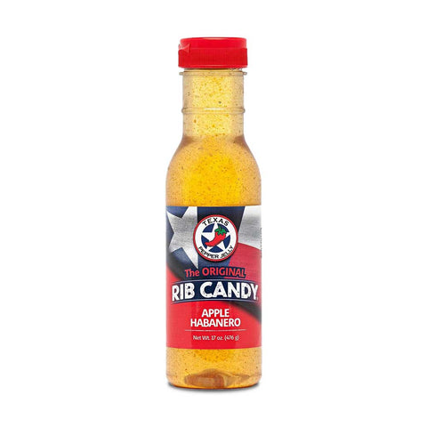Bottle  of Texas Pepper Jelly Apple Habanero Rib Candy, with a label showing apples and habanero peppers. The sauce is designed to glaze meats such as ribs, chicken wings, and pork loin, adding a glossy finish and a blend of sweet and spicy flavors.
