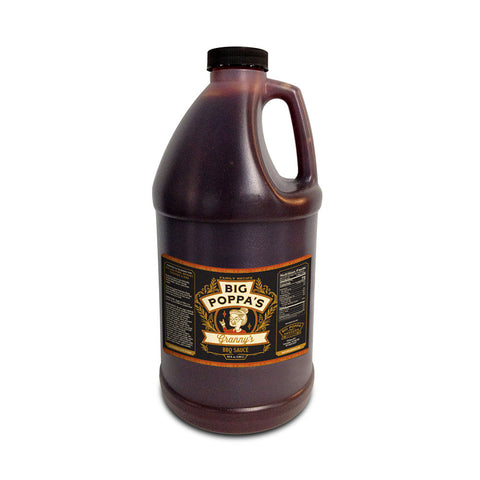 A large plastic jug of Big Poppa's Granny's BBQ Sauce. The jug is dark brown with a black cap and a handle, and features a detailed label in yellow and white text on a dark background, emphasizing the homemade style of the sauce.