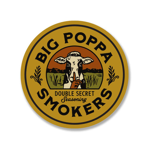 Round sticker featuring the Big Poppa Smokers logo with a cow illustration in the center, surrounded by the words 'Big Poppa Smokers Double Secret Seasoning' in black and white on a yellow and brown background.