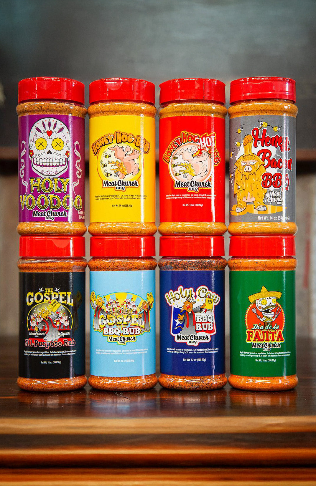 Image of eight of Meat Church seasonings that include Honey Bacon BBQ, Holy Voodoo, The Gospel and many more.