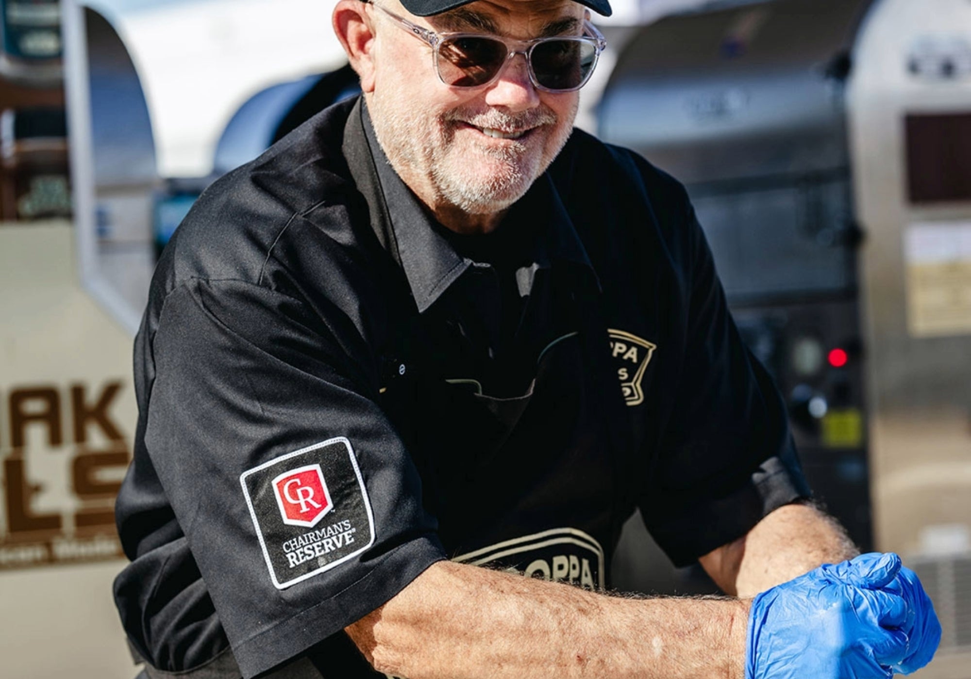 Big Poppa smiling has he is cooking.
