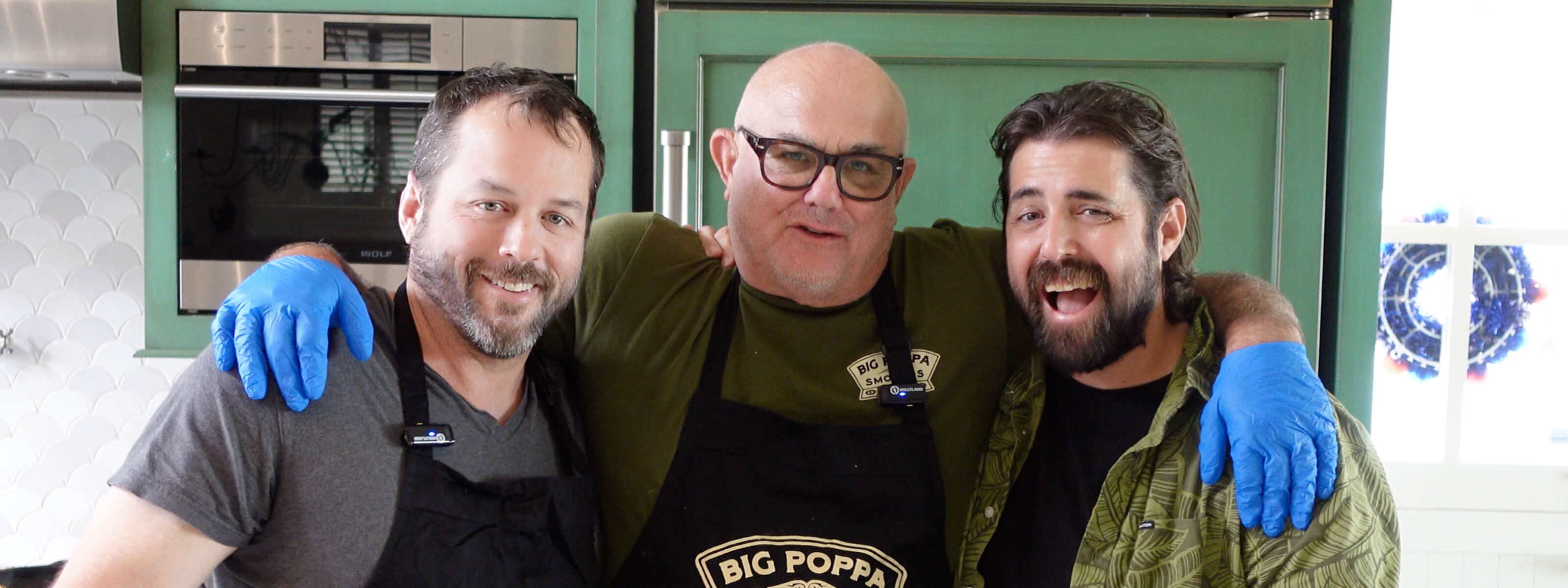 Sterling with two of his sons in the kitchen cooking.