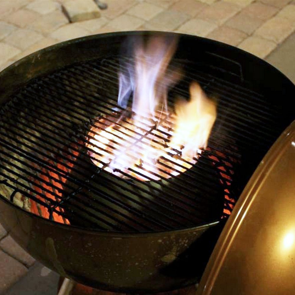 BBQ Vortex accessory placed in grill, optimizing heat flow for perfect cooking results