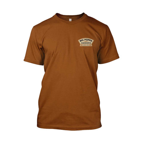A caramel-colored t-shirt featuring the Big Poppa Smokers logo. The front left chest displays a small logo