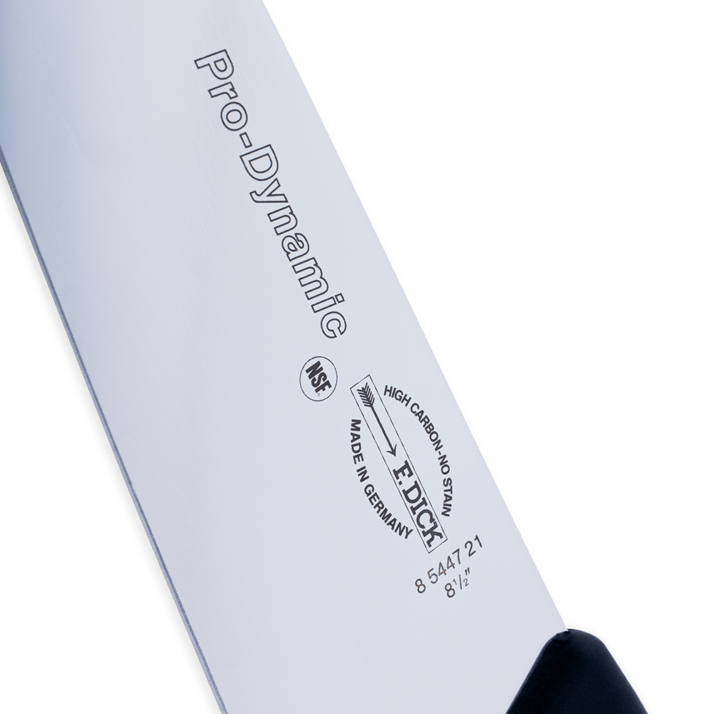 Side close-up of a "Pro-Dynamic" chef’s knife blade with brand markings
