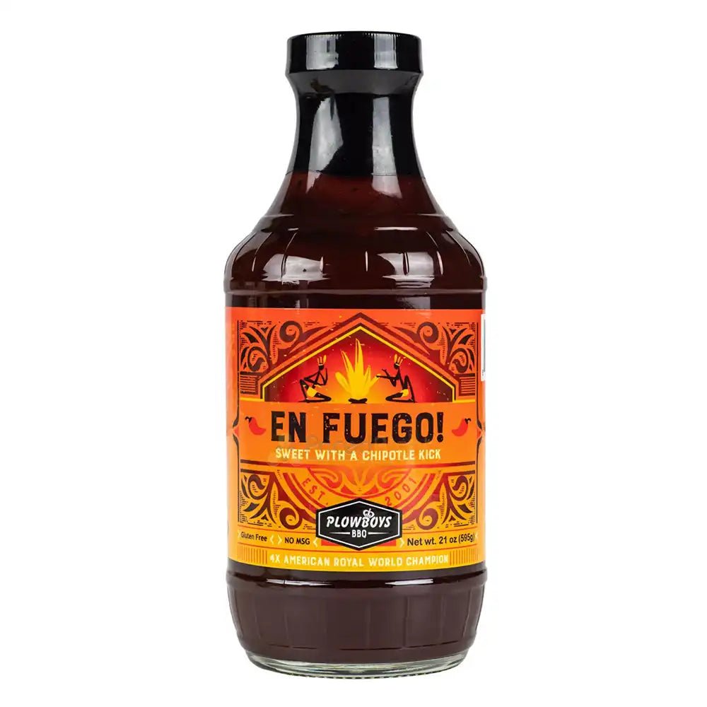 Bottle of En Fuego BBQ Sauce by Plowboys, labeled “Sweet with a Chipotle Kick,” 21 oz.