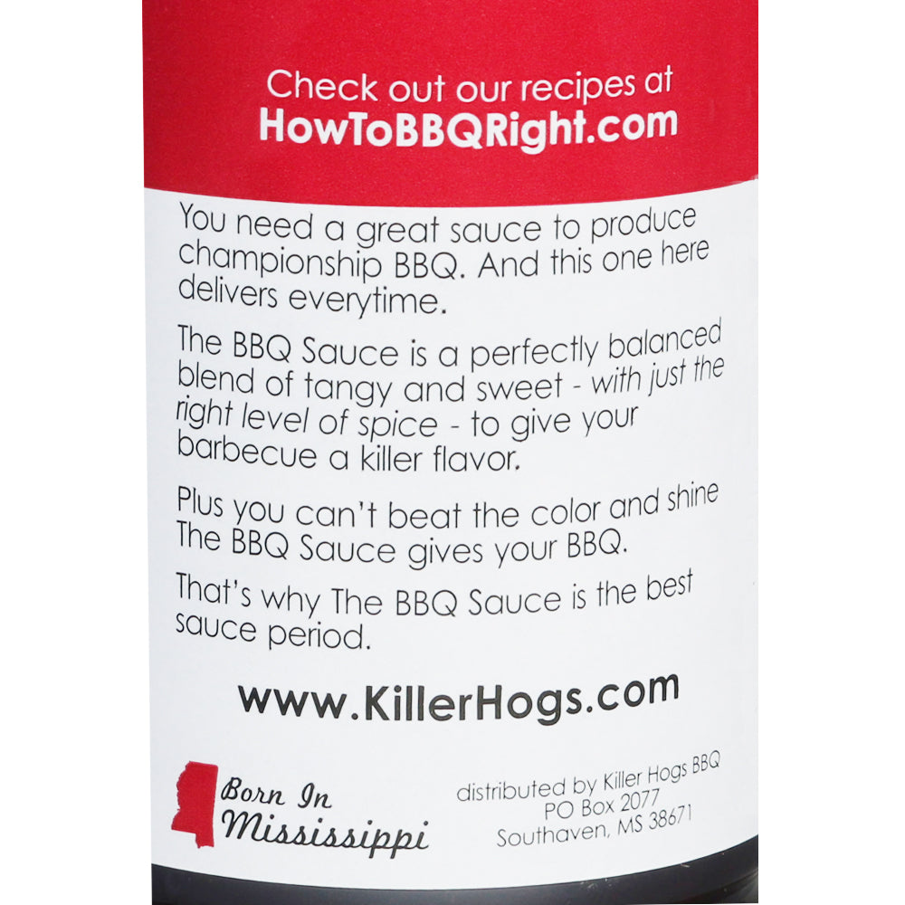 Bottle of Killer Hogs The BBQ Sauce, prominently displaying its label, ideal for adding a flavorful punch to any BBQ dish with its perfect blend of heat, sweetness, and tanginess. Great for both competitive and backyard BBQs.  It is the backyard of Killer Hogs.
