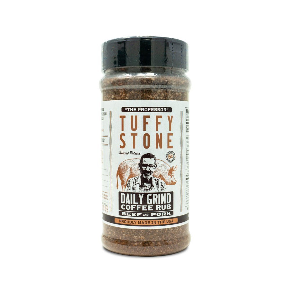 A clear plastic jar of Tuffy Stone Daily Grind Coffee Rub for beef and pork with a black lid, featuring the brand logo, a picture of Tuffy Stone, and a pig on the label.