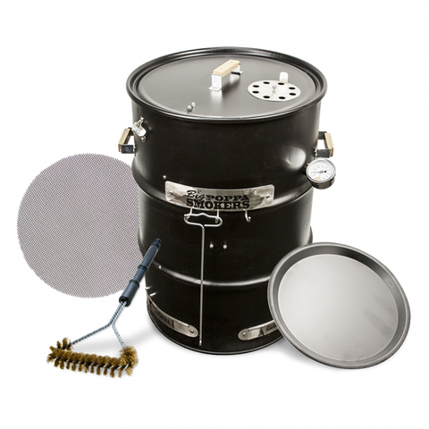 An assembled BPS DIY Drum Smoker Kit with a black barrel, displaying accessories like a grill grate, thermometer, and a cleaning brush, against a dark background.