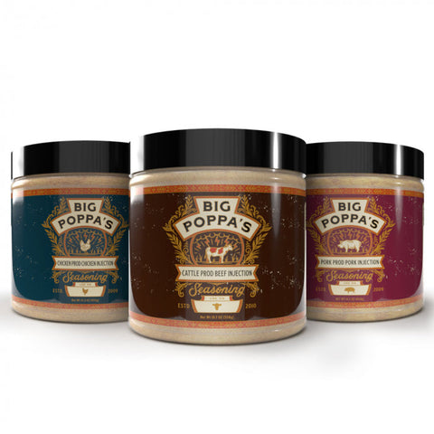 Three jars of Big Poppa's injection seasonings, arranged side by side. From left to right: Chicken Prod Chicken Injection Seasoning in a blue jar, Cattle Prod Beef Injection Seasoning in a brown jar, and Pork Prod Pork Injection Seasoning in a burgundy jar. Each jar features a vintage-style label with ornate gold detailing and the established year highlighted, showcasing the specific use for each type of meat.