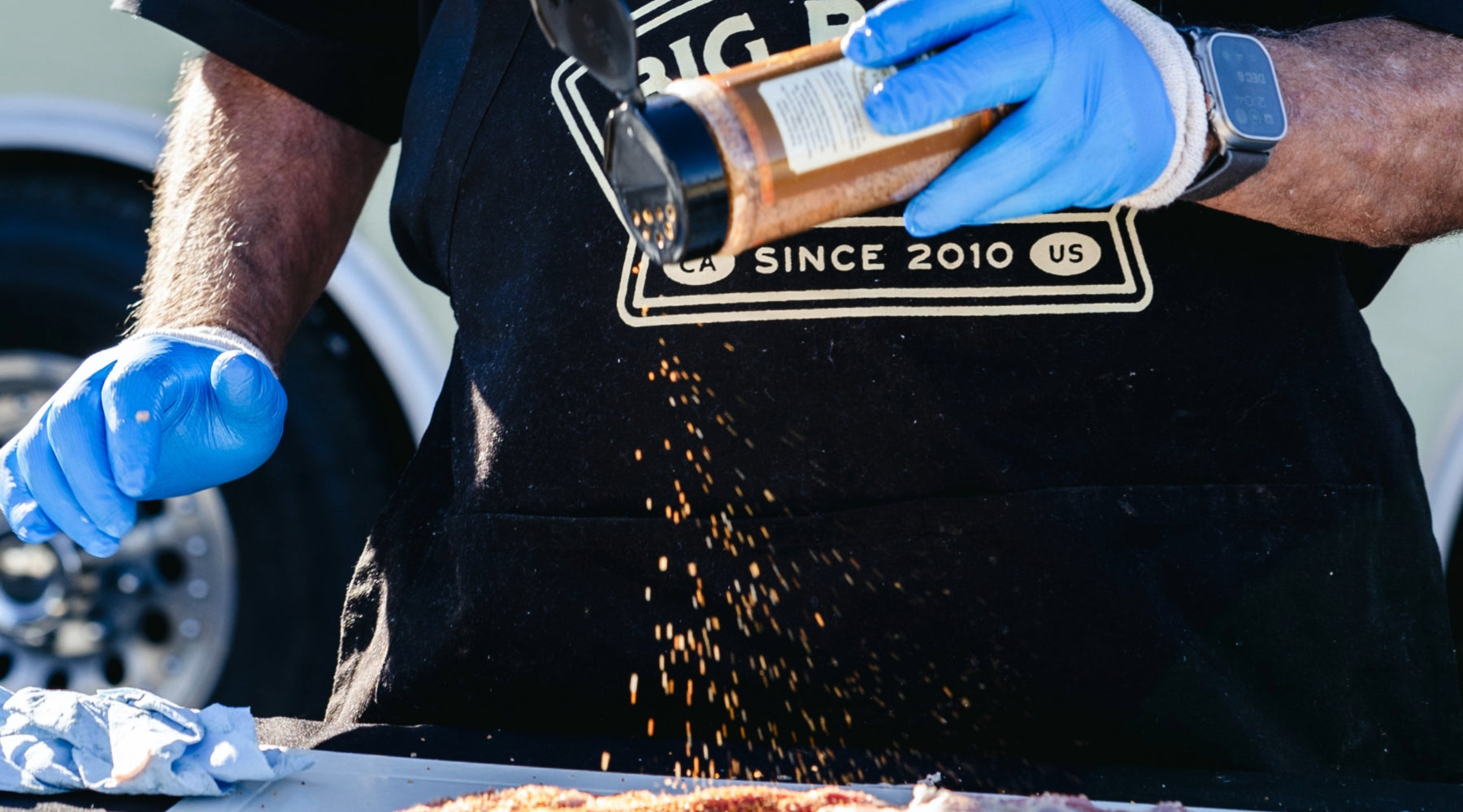 Big Poppa seasoning ribs with Sweet Money