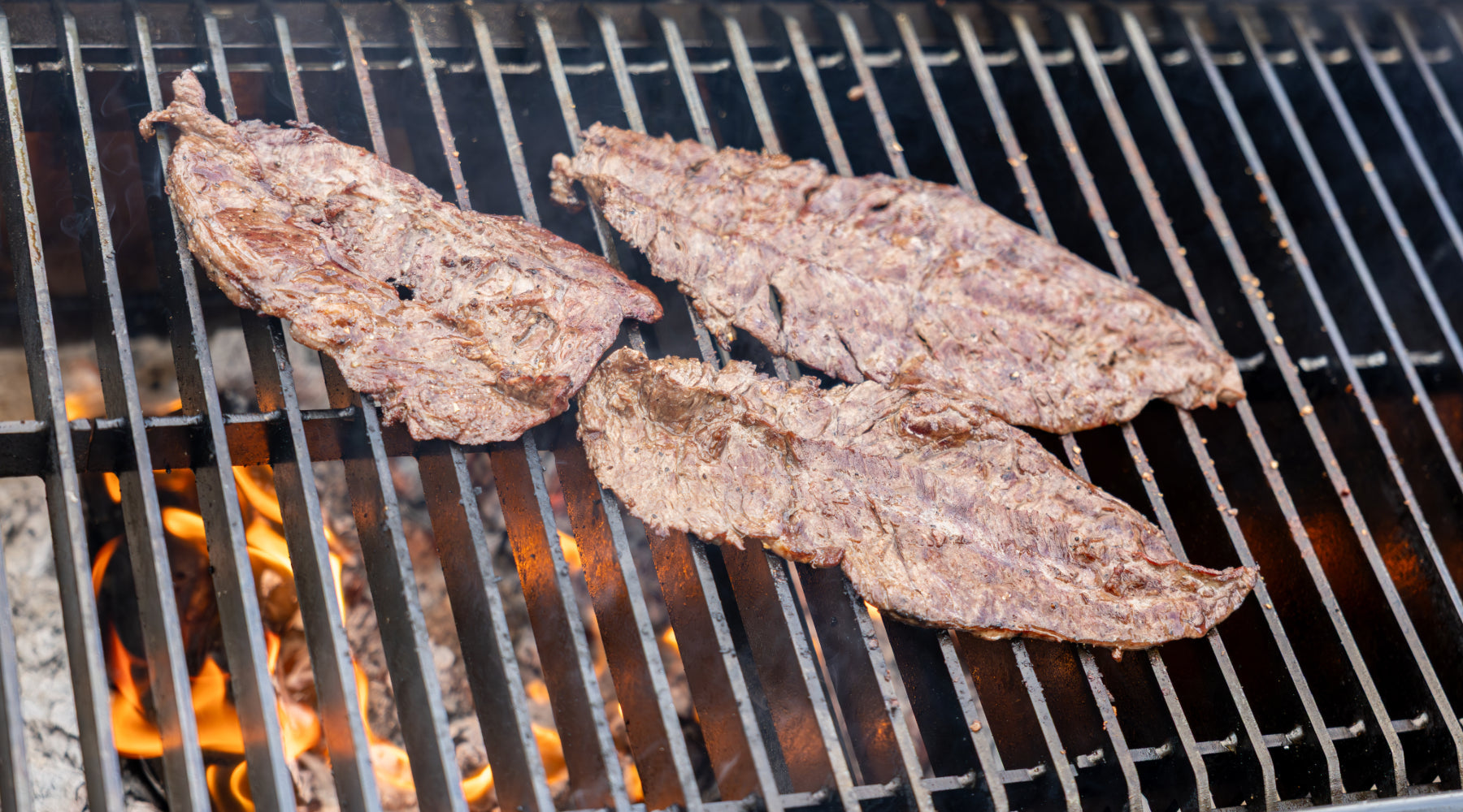 Meat on the grill cooking