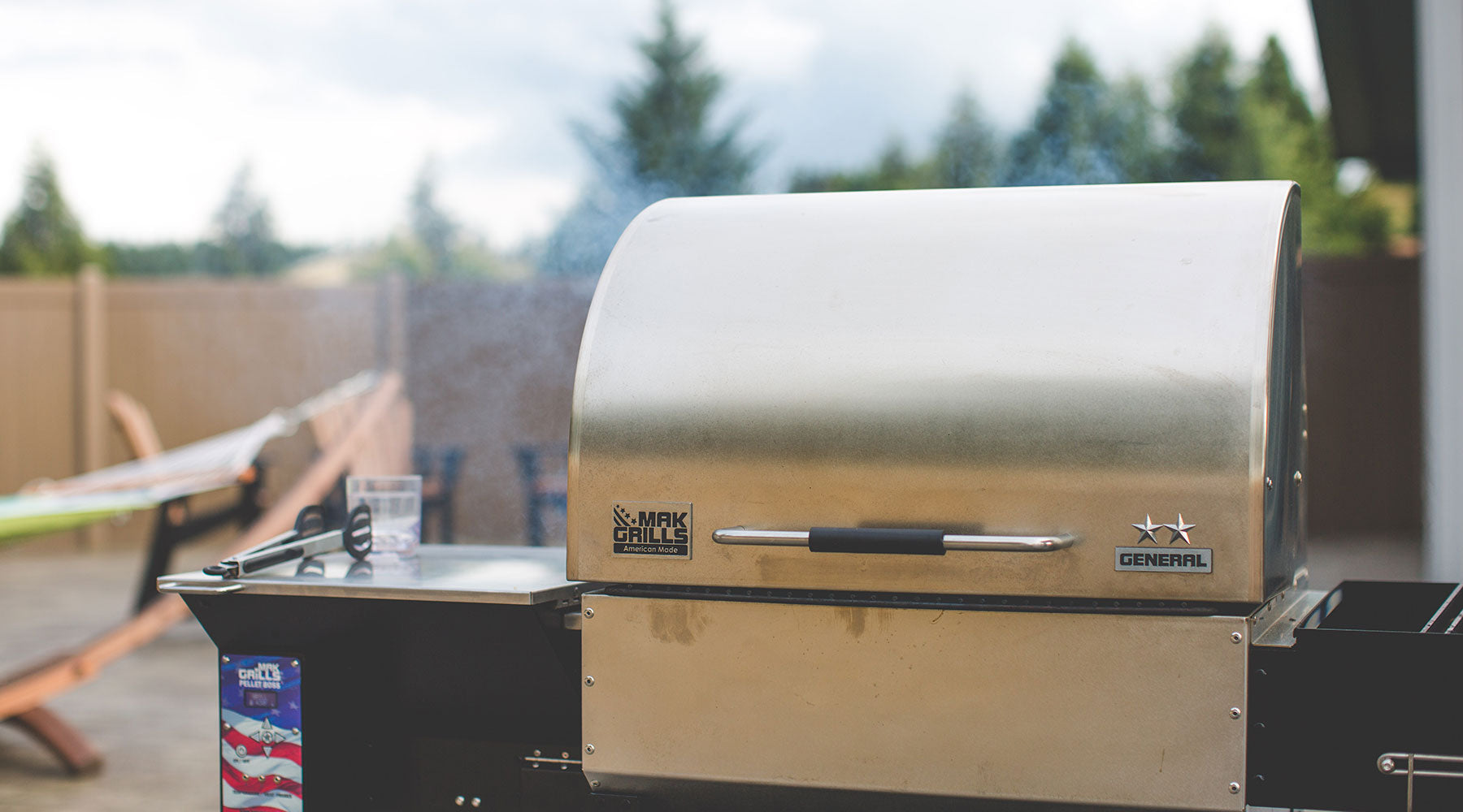 MAK Pellet Smoker in the backyard getting ready for summer cooking