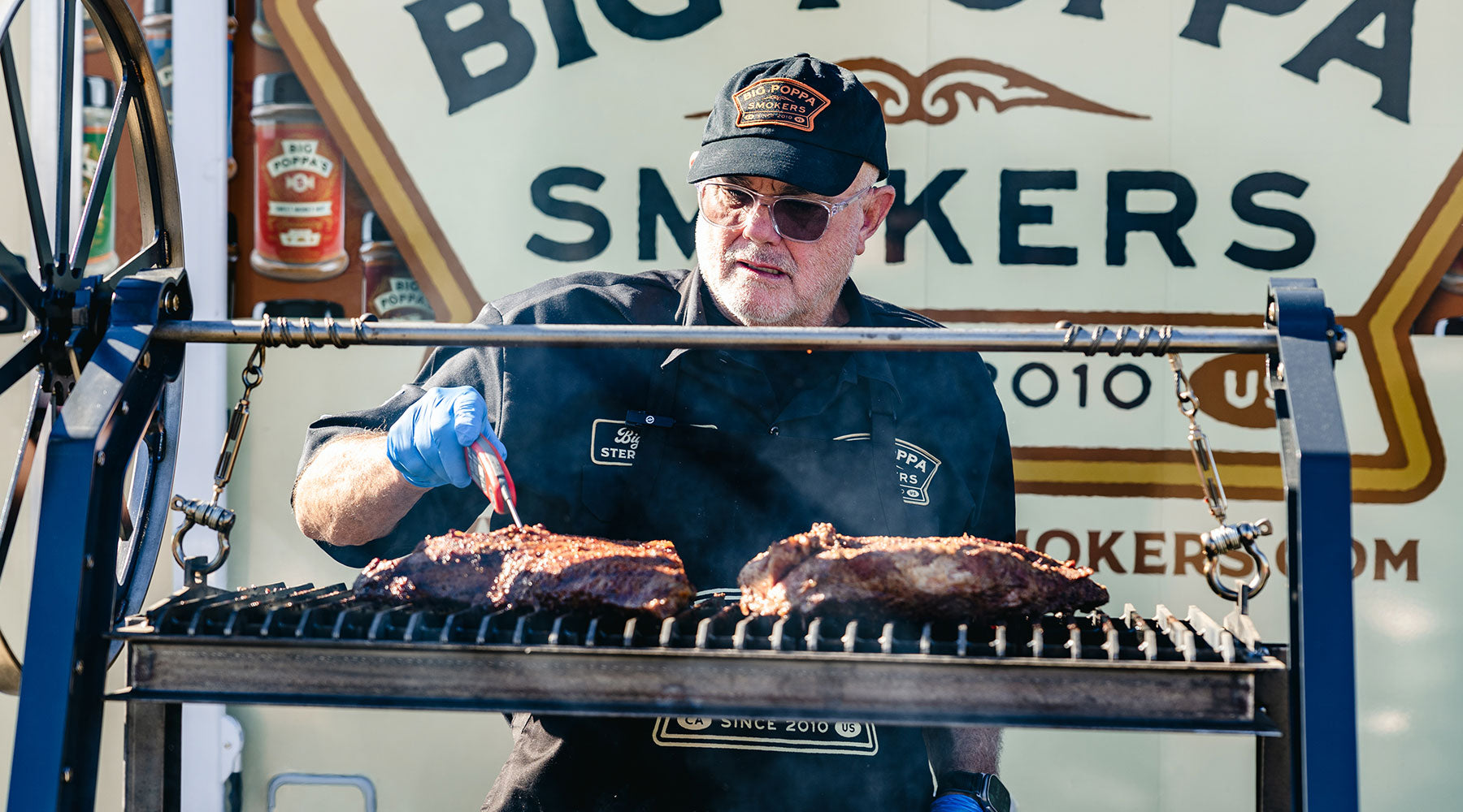 Image of Sterling using his digital thermometer to check the internal temperature of the tri-tip