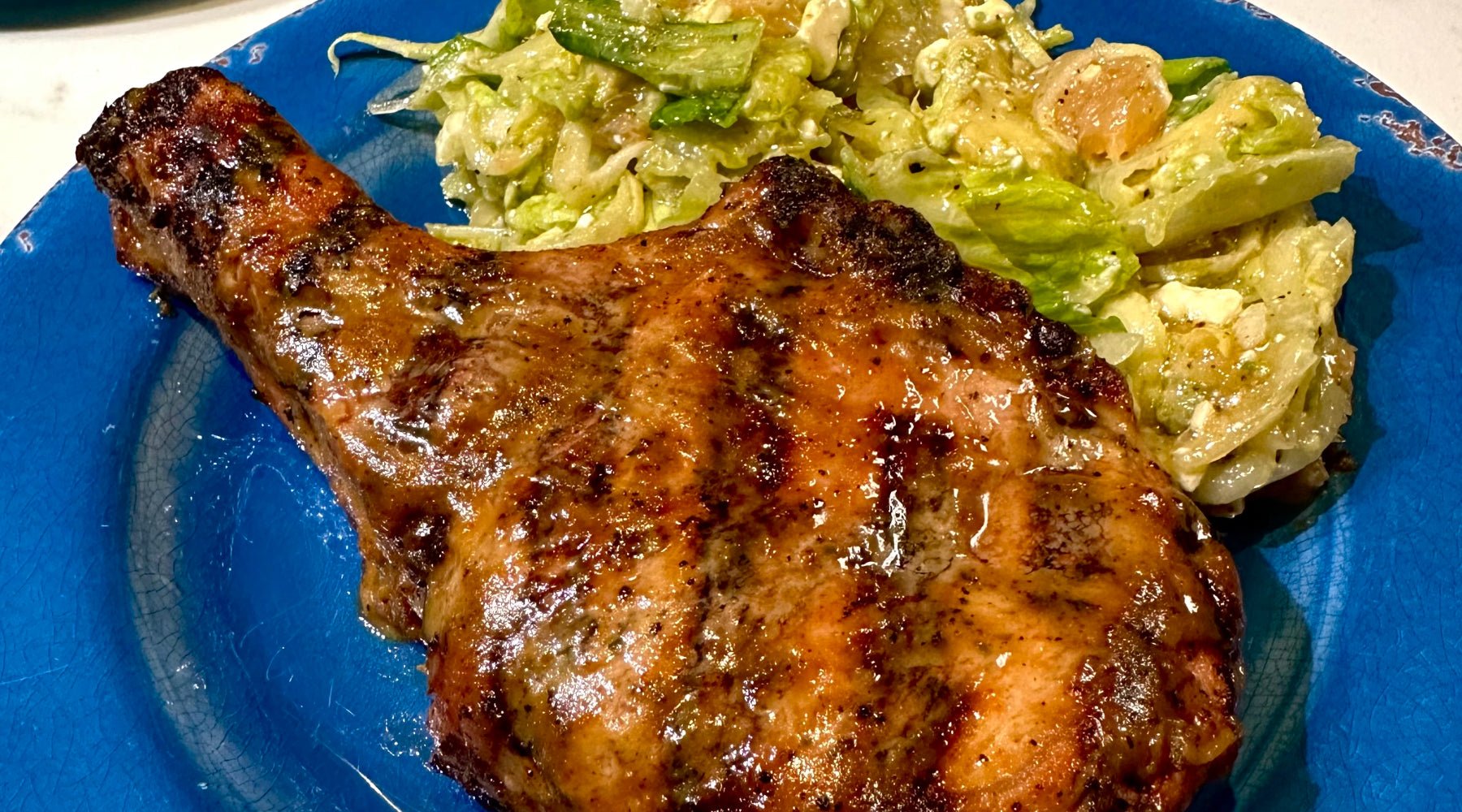 Brown sugar and dijon based pork chop with a simple side salad.