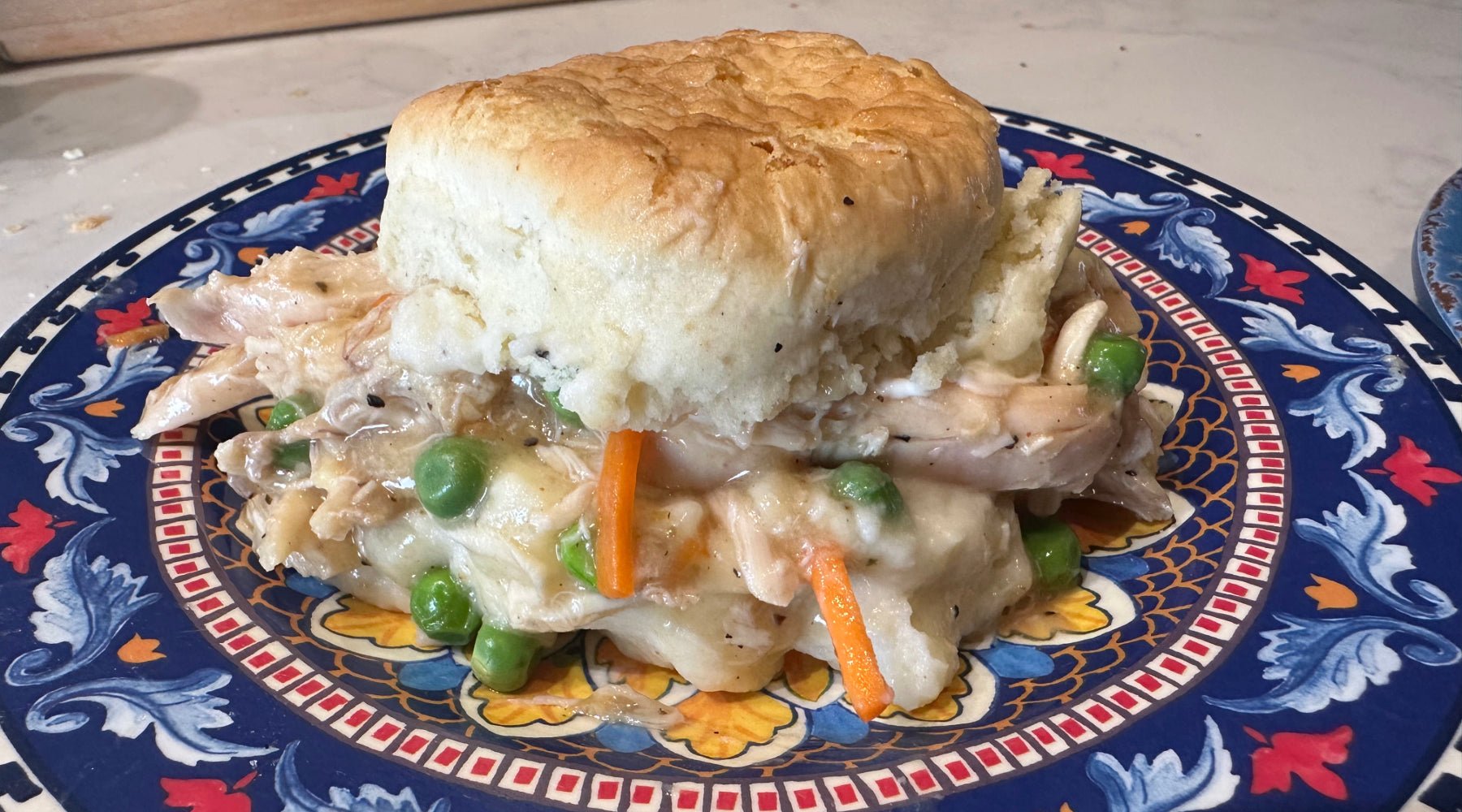 Chicken pot pie on a dumpling biscuit