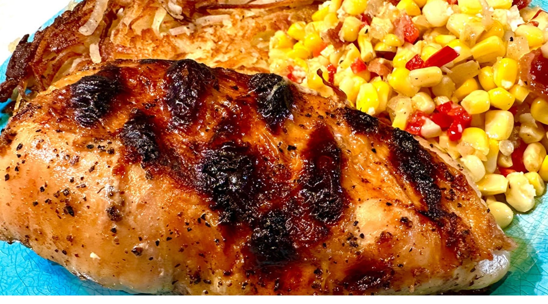 Perfectly cooked chicken breast and sides for dinner