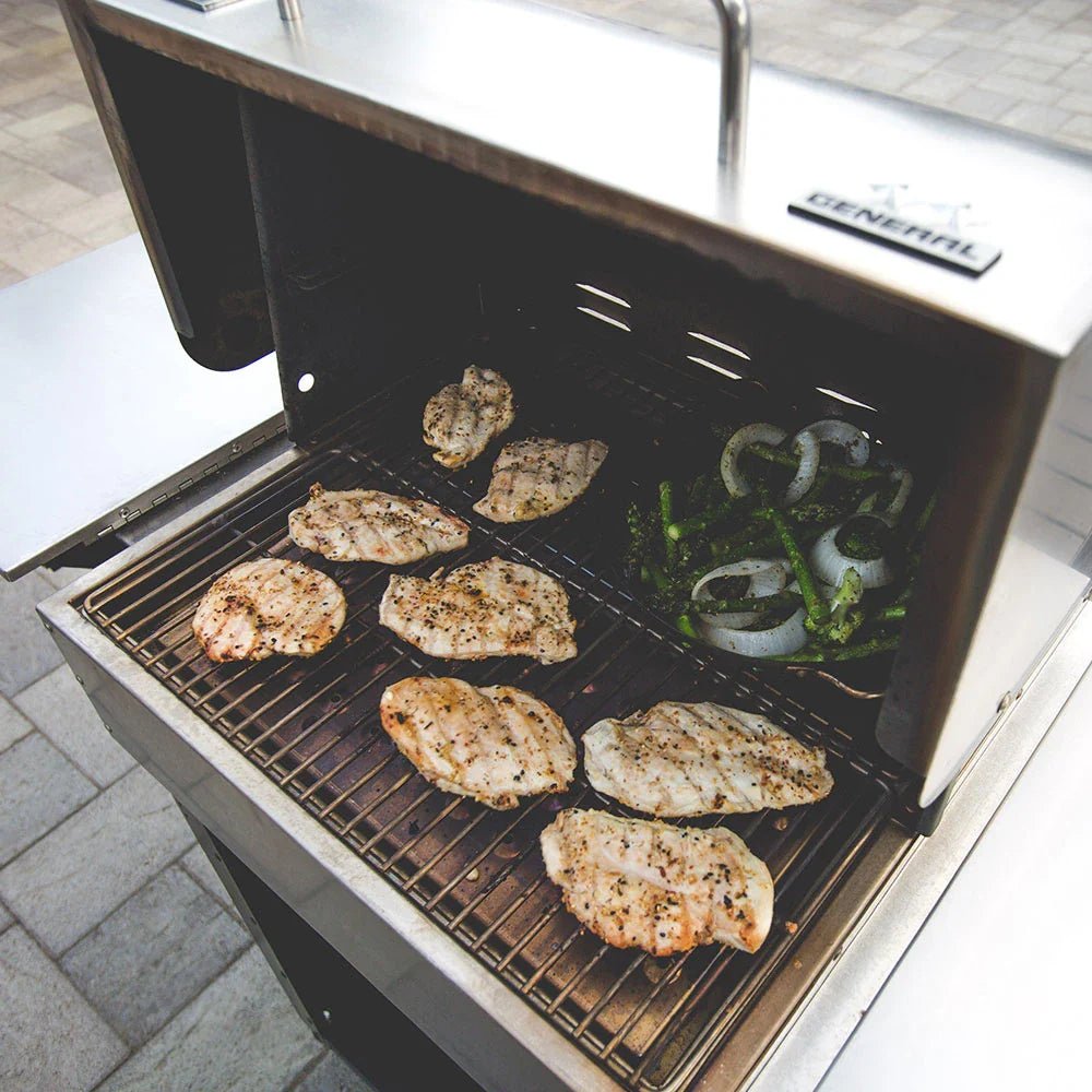 Image of chicken and vegetables on the MAK Grill cooking.