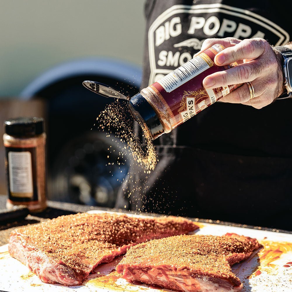 Big Poppa seasoning the meat.