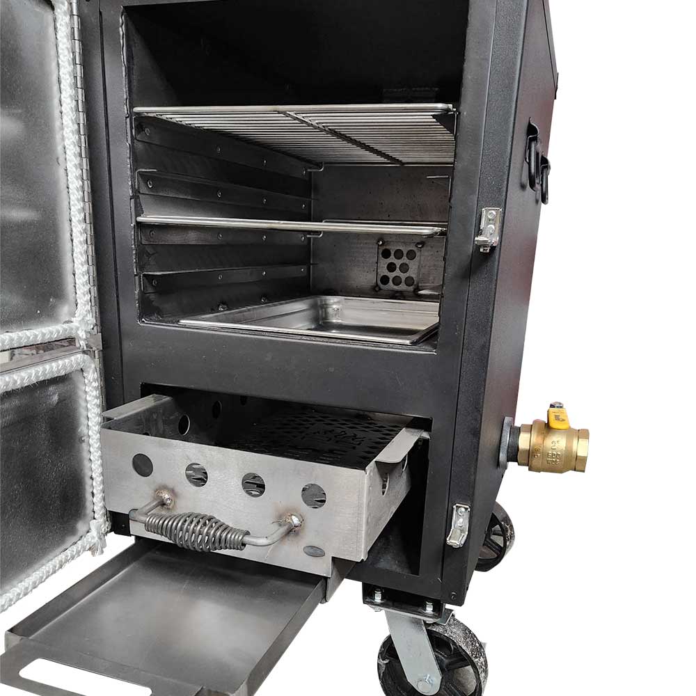 The interior of a BBQ smoker with one door open, showing metal racks, a drip pan, and a charcoal drawer with a spring handle. A brass fitting is visible on the side.