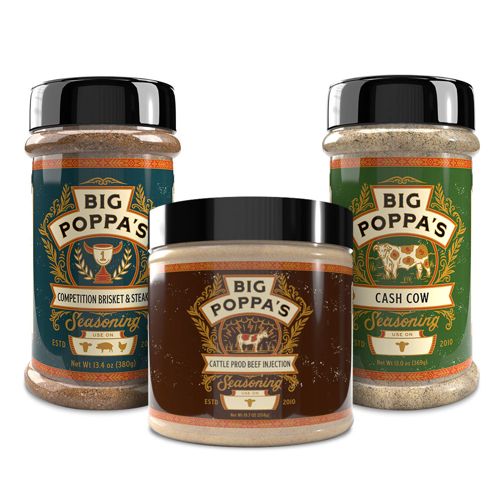 Three jars of Big Poppa's seasoning products displayed together. From left to right: a tall jar labeled 'Competition Brisket & Steak Seasoning' with a blue label featuring a trophy icon, a shorter jar labeled 'Cattle Prod Beef Injection' with a brown label and a cow illustration, and another tall jar labeled 'Cash Cow Seasoning' with a green label and a cow icon. Each jar shows the Big Poppa's logo at the top, and the labels include 'Gluten Free' and 'MSG Free' details.