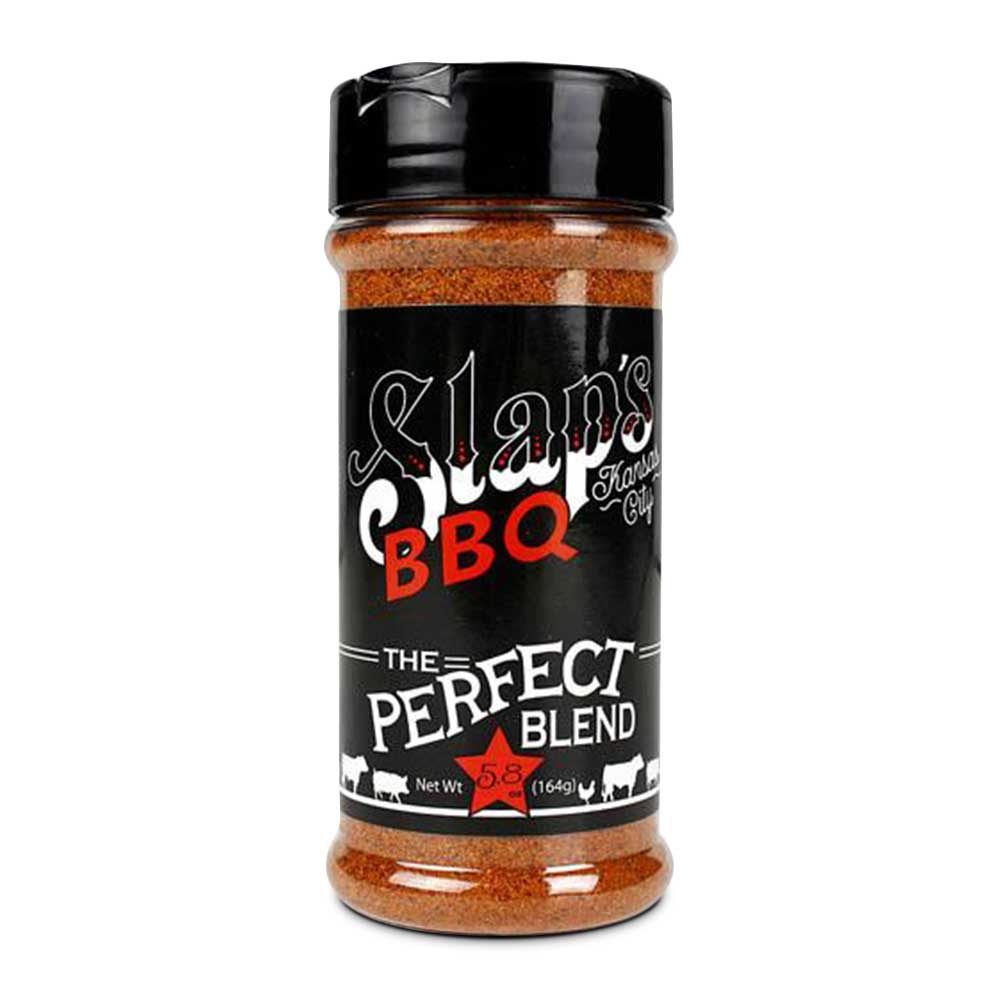 A bottle of Slap's BBQ seasoning labeled "The Perfect Blend" with a black cap. The label is predominantly black with the brand's logo in white and red text. It includes illustrations of a pig, cow, and chicken along the bottom, with the net weight listed as 5.8 ounces (164 grams).