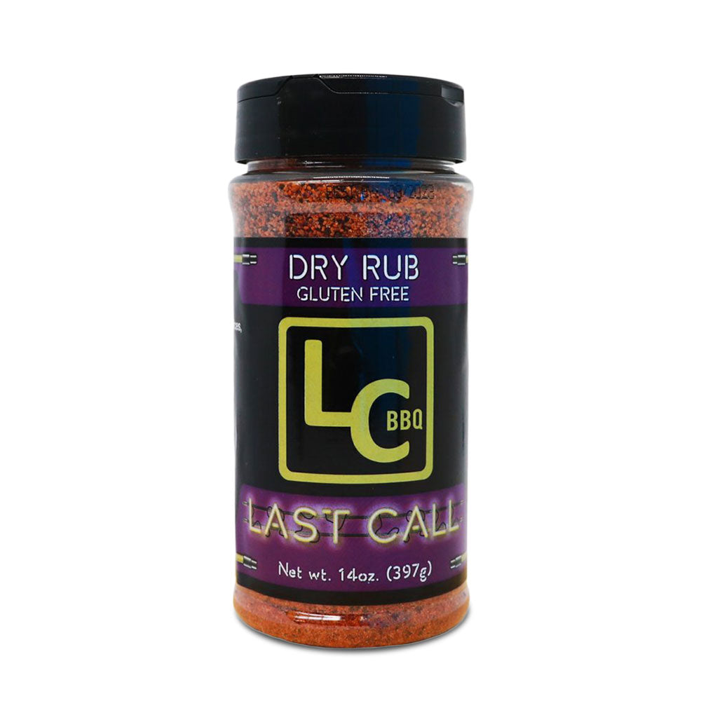 A bottle of LC BBQ Last Call Dry Rub viewed from the front. The label features the LC BBQ logo and text indicating that it is a gluten-free dry rub. The label also specifies that the bottle contains 14 ounces (397 grams) of seasoning.