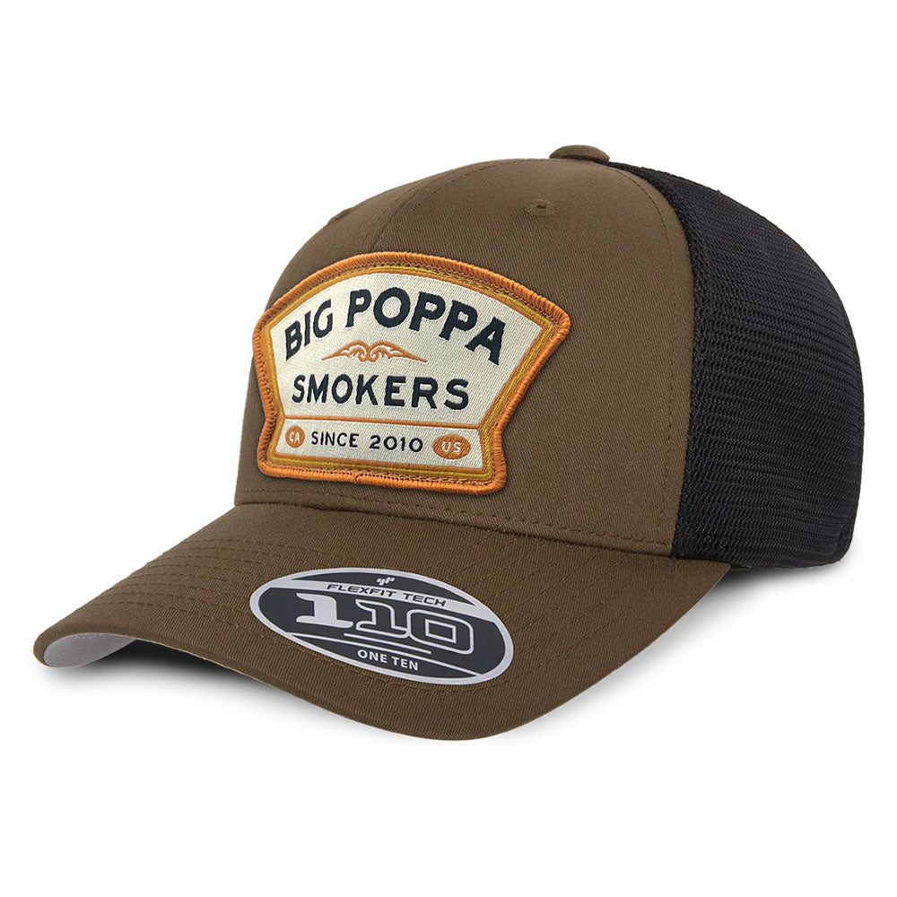 A brown and black trucker-style hat with a beige and orange patch on the front reading 'Big Poppa Smokers' and 'CA Since 2010'.