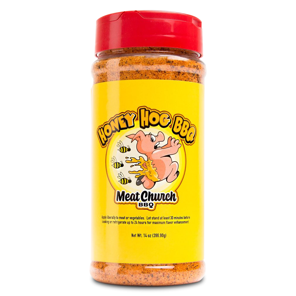 A 14-ounce jar of Meat Church Honey Hog BBQ Rub. The label is yellow with red text and features a cartoon pig breathing fire, surrounded by bees. The jar has a red lid and contains a coarse, reddish-brown spice mix.