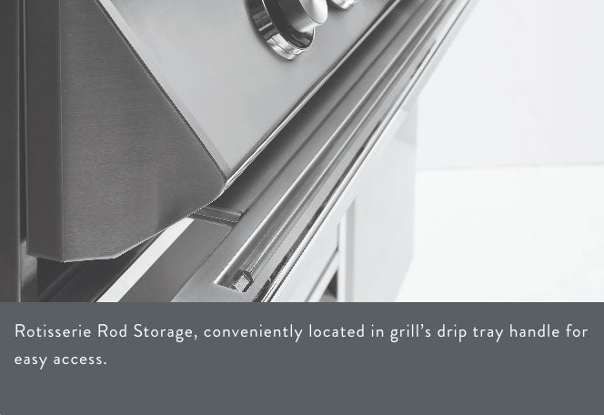 Close-up of rotisserie rod storage in a grill, conveniently located in the grill’s drip tray handle for easy access.