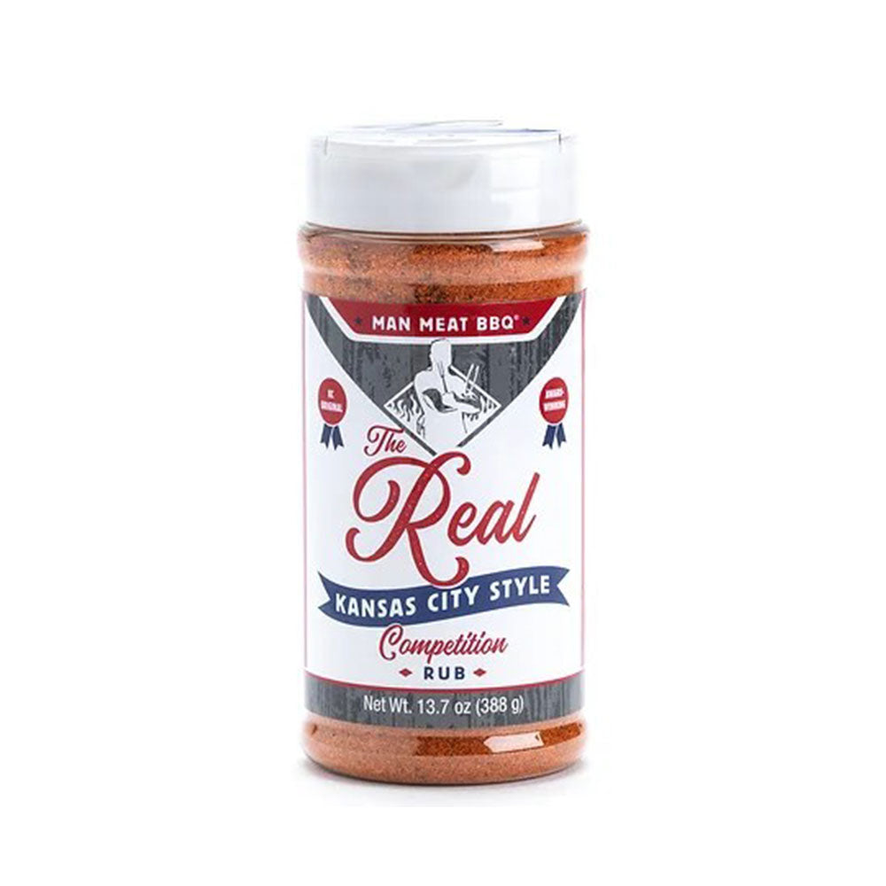 A 13.7-ounce jar of Man Meat BBQ Kansas City Style Competition Rub. The label is white with red and blue text, featuring a pig and grill logo. The rub is a reddish-brown spice mix.