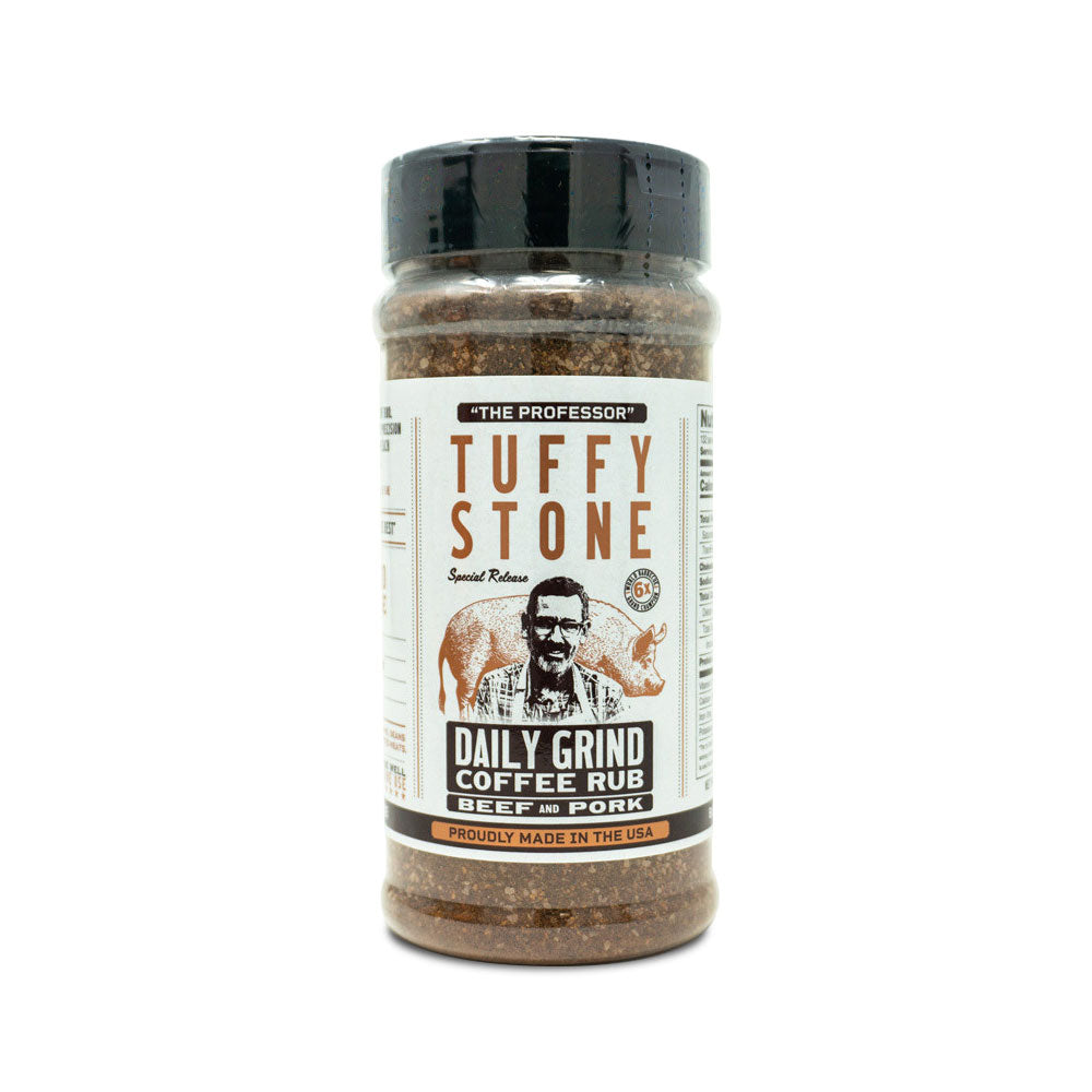 A clear plastic jar of Tuffy Stone Daily Grind Coffee Rub for beef and pork with a black lid, featuring the brand logo, a picture of Tuffy Stone, and a pig on the label.