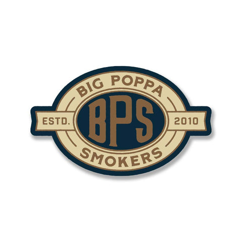 Oval-shaped logo badge featuring the text 'Big Poppa Smokers' around the top edge and 'BPS' prominently in the center with 'ESTD. 2010' flanking the sides, all set against a cream and navy blue background.