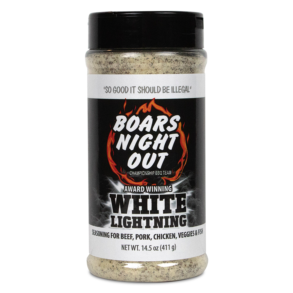 The front of a jar of Boars Night Out White Lightning seasoning with a black lid. The label features the text 'So good it should be illegal' at the top, followed by the Boars Night Out logo with a flaming design. Below, the label reads 'Award Winning White Lightning' and specifies that the seasoning is for beef, pork, chicken, veggies, and fish. The net weight is 14.5 ounces (411 grams).