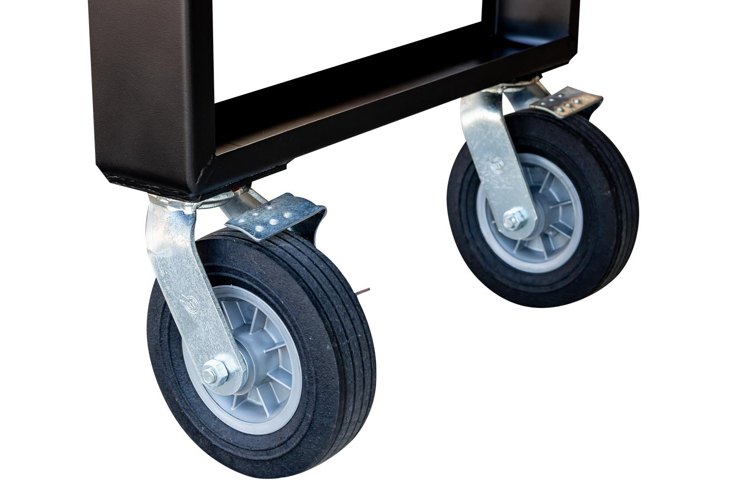 Close-up view of two 8-inch locking casters attached to the frame of a Meadow Creek smoker and cooker. The casters are heavy-duty with metal brackets and black rubber wheels.