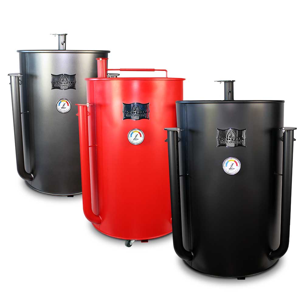 Image of three Gateway Drum Smokers in a lineup. From left to right, the smokers are charcoal, red, and black. Each smoker has a top vent, front thermometer gauge, and brand logo above the thermometer.