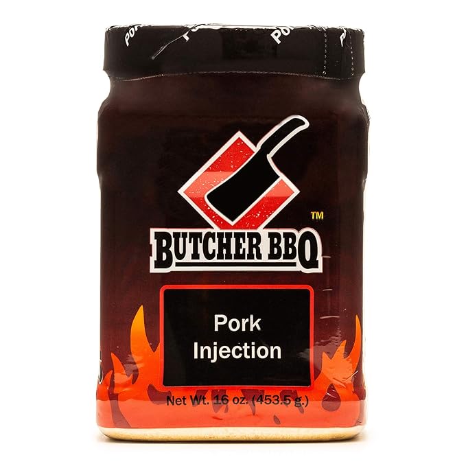 The front of a package of Butcher BBQ Pork Injection with a black lid. The label features the Butcher BBQ logo with a red meat cleaver icon. The package reads 'Pork Injection' and indicates the net weight of 16 ounces (453.5 grams).
