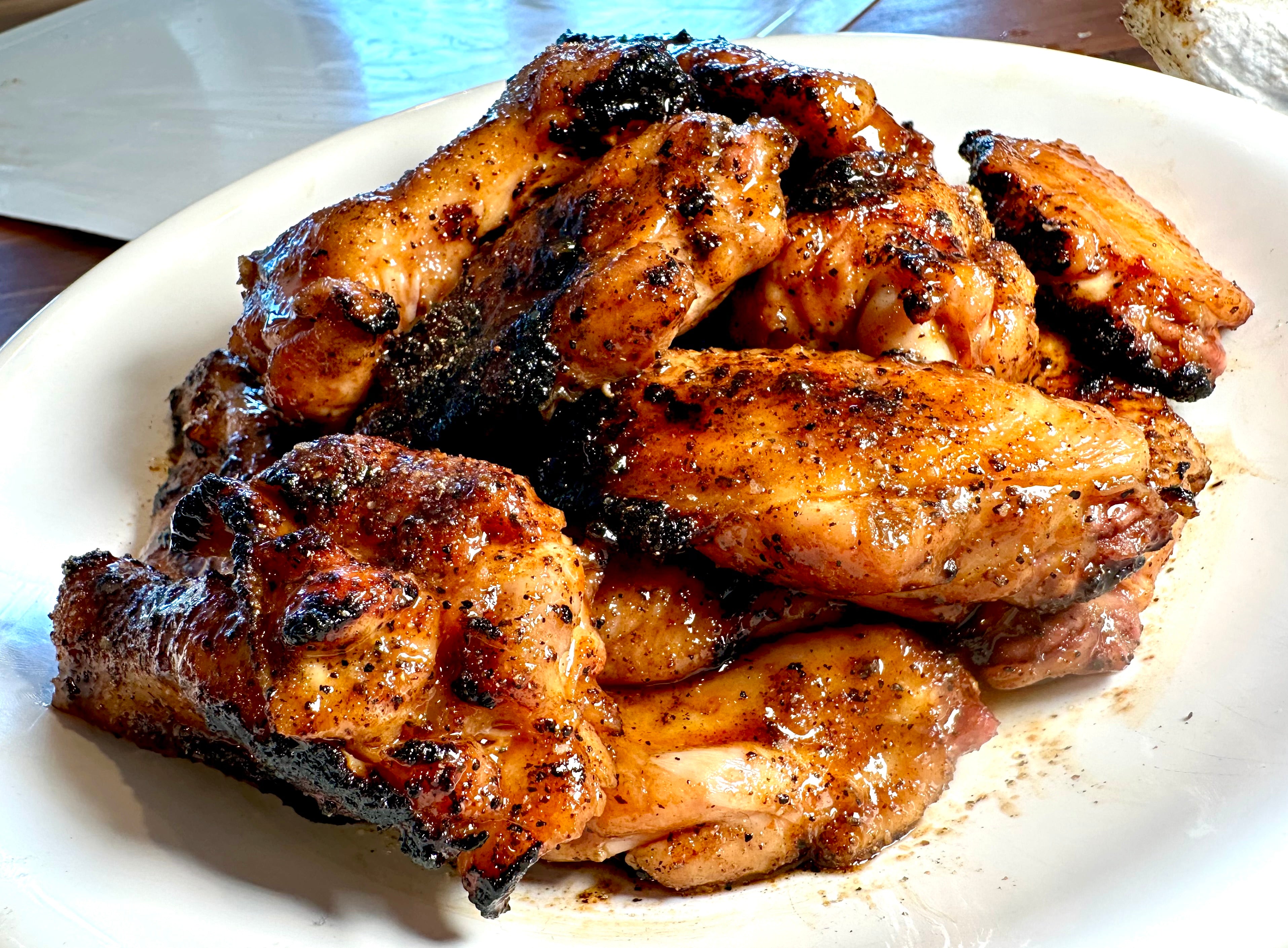 Big Poppa's Honey Sriracha Wings on a white plate.