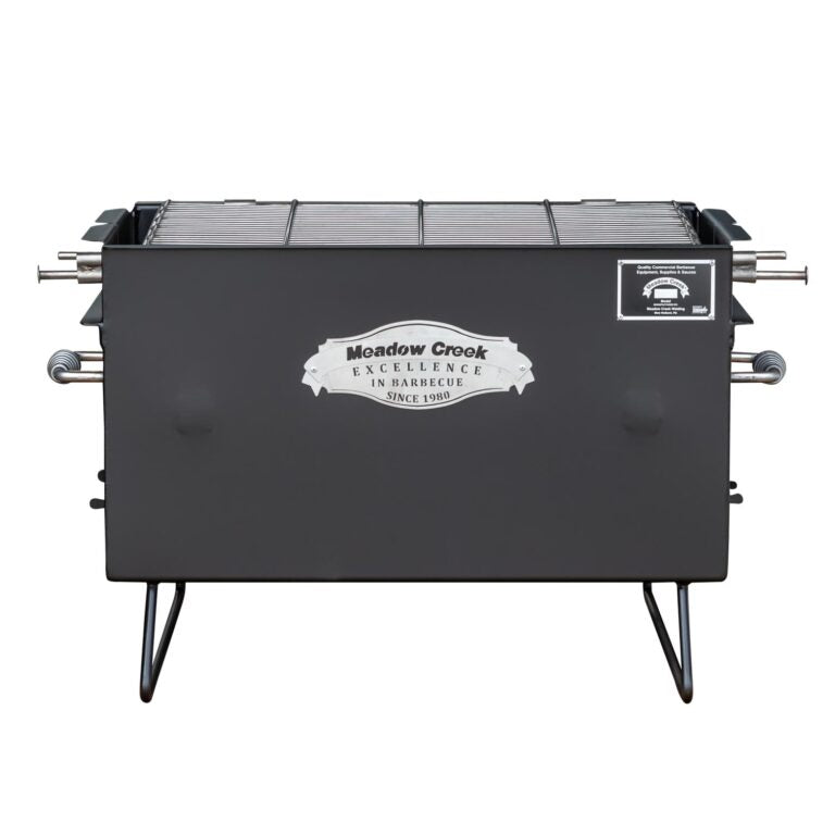 Front view of the Meadow Creek BBQ26 Chicken Cooker, showing the stainless steel grate inside. The cooker has "Meadow Creek Excellence in Barbecue Since 1980" logo on the front.