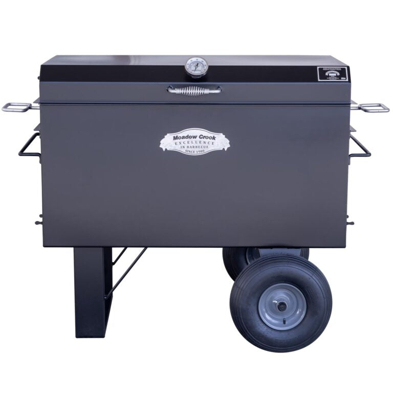 Front view of the Meadow Creek BBQ42 Chicken Cooker with the lid closed. The cooker features a temperature gauge on the lid and the Meadow Creek logo prominently displayed on the front.