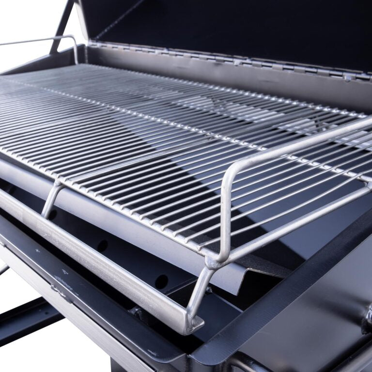 A close-up of the grilling surface on the Meadow Creek PR42 pig roaster, highlighting the stainless steel cooking grates.
