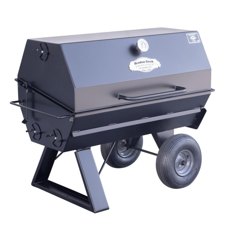 A side view of the Meadow Creek PR42 pig roaster with the lid closed, displaying the sleek black exterior and sturdy construction.