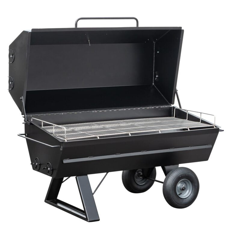 An open Meadow Creek pig roaster with two large wheels and a black metal body, revealing the stainless steel cooking grate.