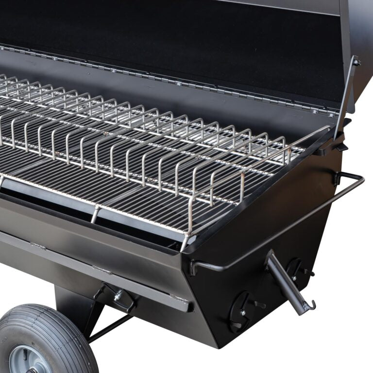 A close-up of the rib rack on the Meadow Creek PR72 pig roaster, emphasizing the durable stainless steel construction and ample cooking space.