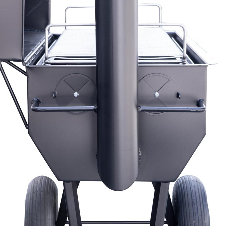 Rear view of a Meadow Creek smoker, highlighting the stack vents and the main cooking chamber. The smoker has a robust build with a focus on airflow control for efficient smoking.