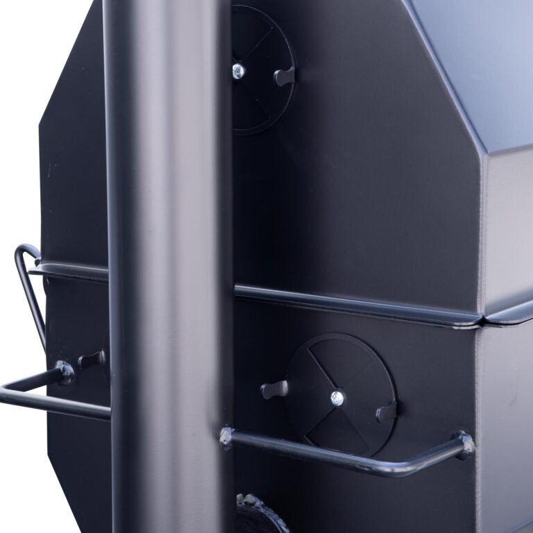Close-up view of the back of a Meadow Creek smoker, showing the stack vents and the sturdy construction. The vents can be adjusted to control the airflow during smoking.
