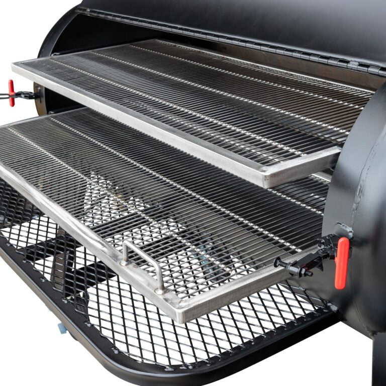 Close-up of the sliding stainless steel grates inside a Meadow Creek BBQ smoker.